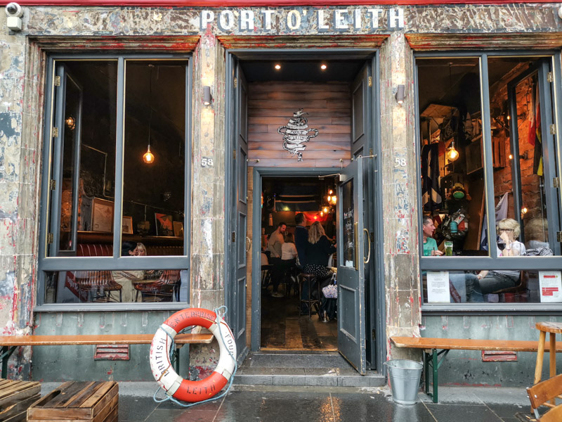 People drinking at Port o Leith pub in Leith Edinburgh