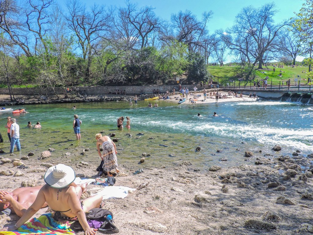 Barton Springs sunbathing blue skies