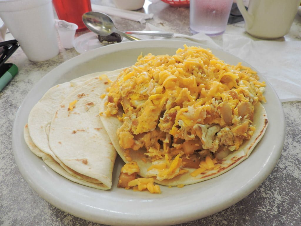 Don Juan El Taco Grande Juan in a Million plate soft tacos and pile of eggs. 