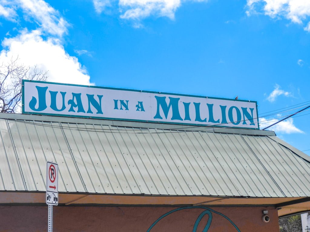 Juan in a Million Restaurant in Austin. Sign, blue skies