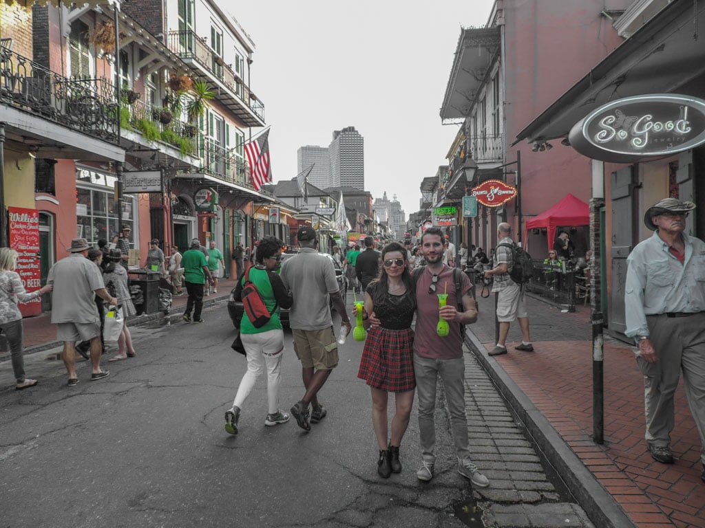 Couple with Hand Grenades cocktails on Bourbon Street 