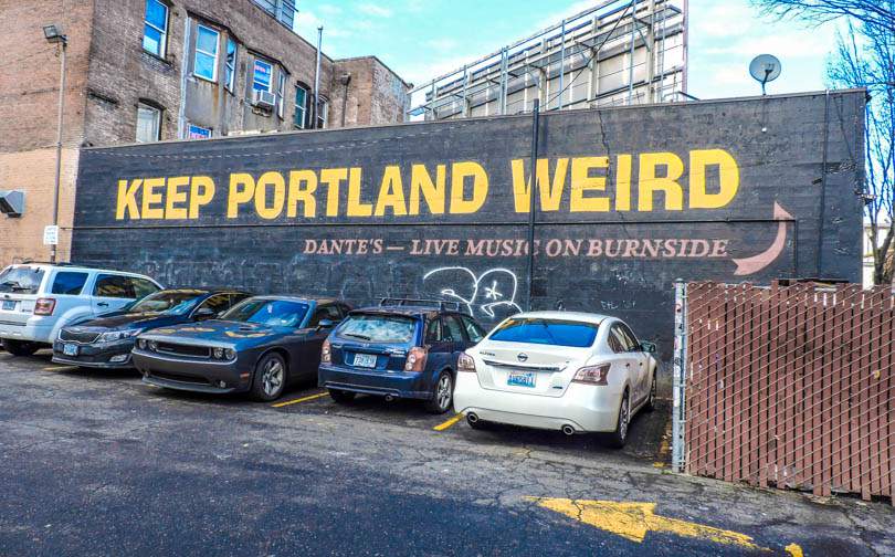 Keep Portland Weird sign with cars