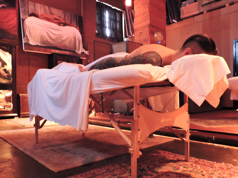 Man lying down on massage table at Little Red Day Spa Seattle