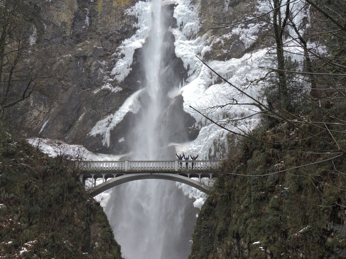Multnomah Falls in Oregon with snow on rocks