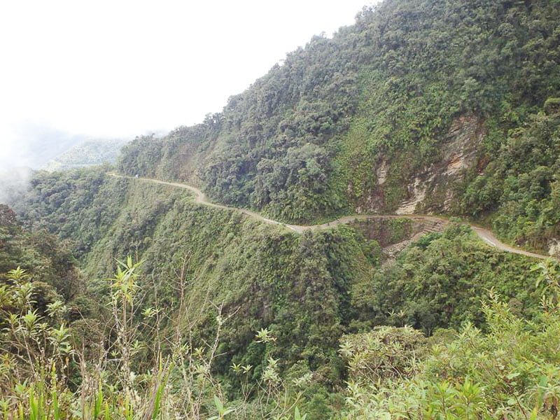 Death Road Bolivia cycle dirt road with vegetation