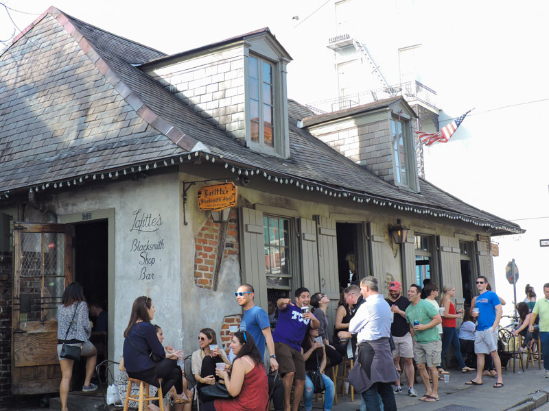 Lafitte Blacksmith Shop Bar with people standing outside in New Orleans_