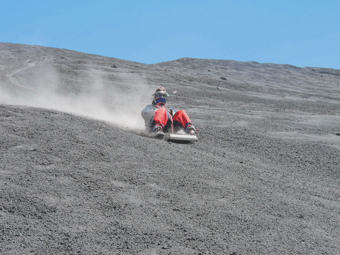 Woman does Volcano Boarding down volcano in Nicaragua