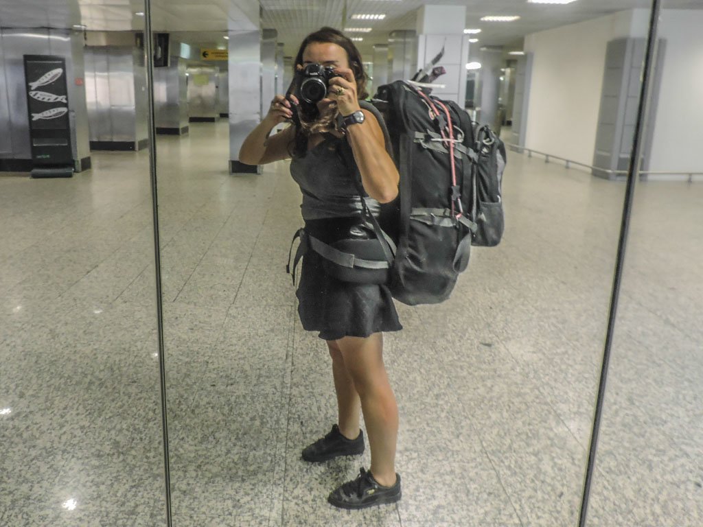 Woman wearing Vango 80 Litre Rucksack Backpack at airport