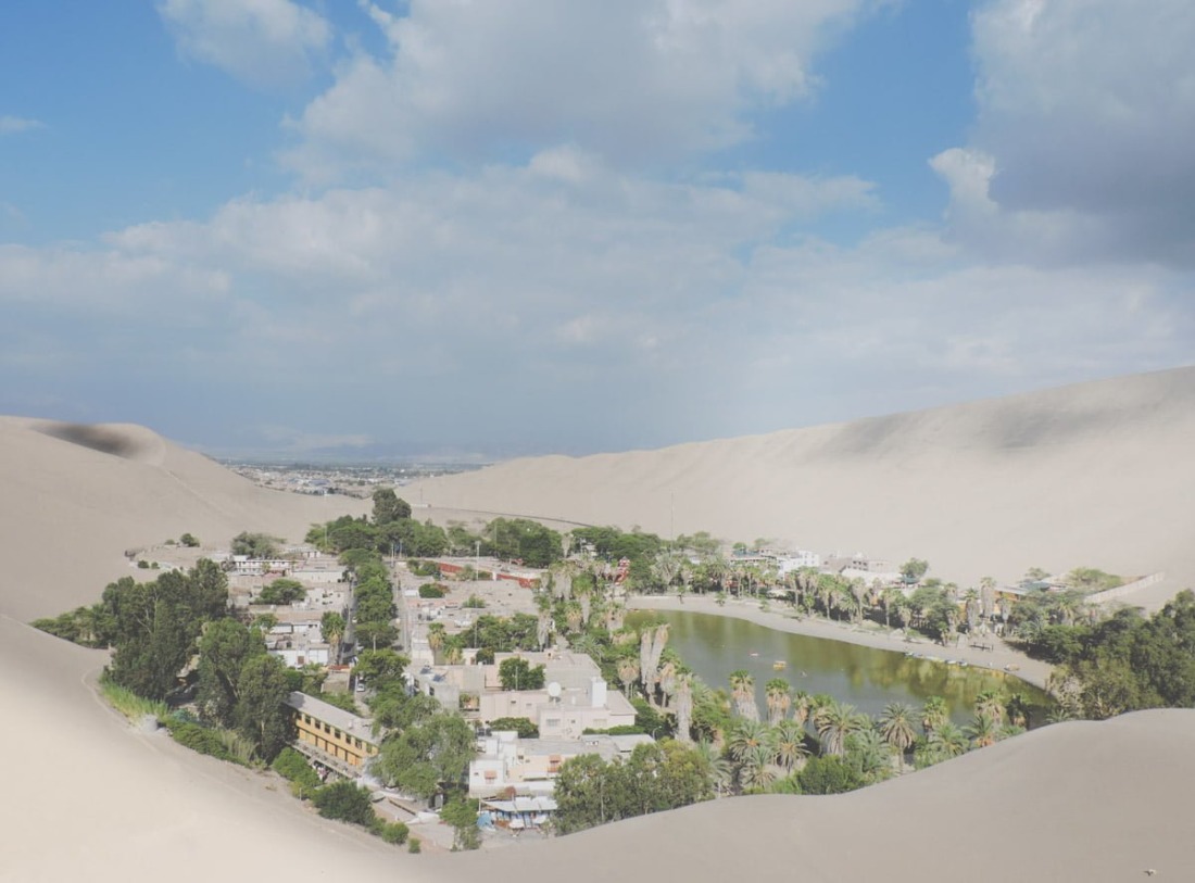 Huacachina lagoon view of town and water in Peru