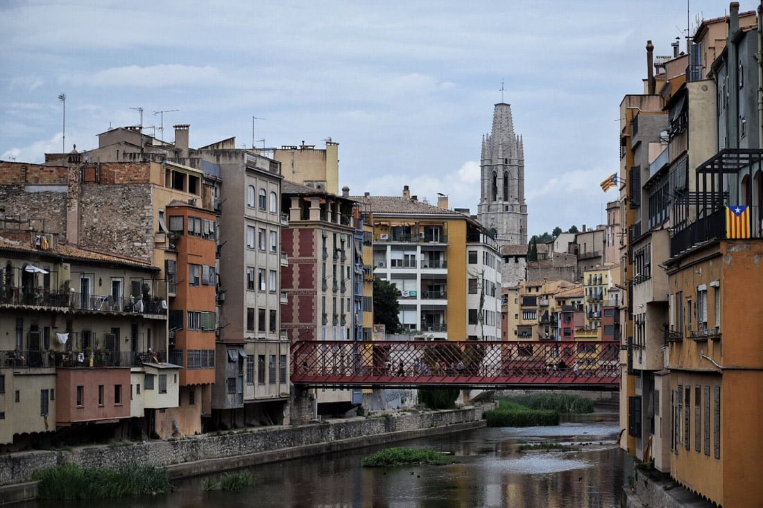 Buildings by canal water in Girona Spain