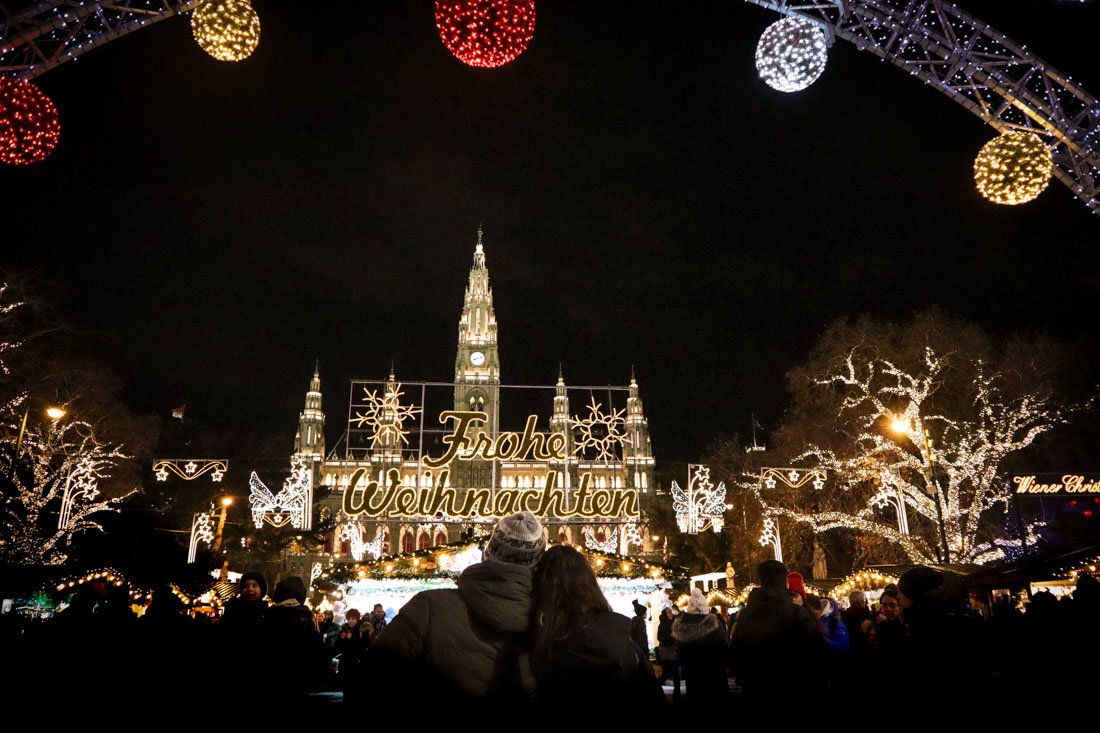 Couple cuddling at Christmas Markets Vienna Austria