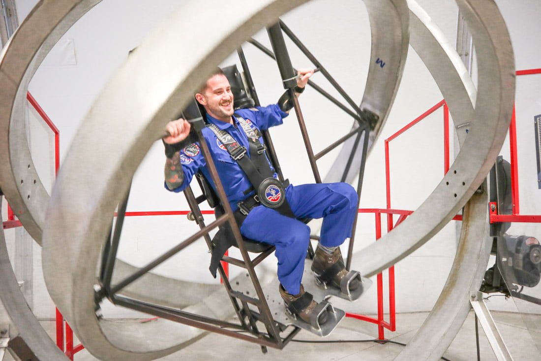 Man in space suit on NASA simulator at Space Camp in Huntsville Alabama