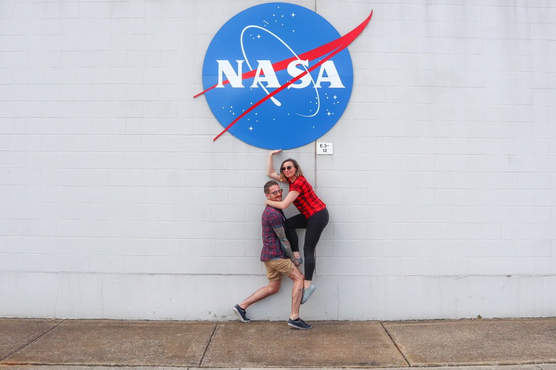 Couple posing at NASA sign at Marshall Flight Center Huntsville