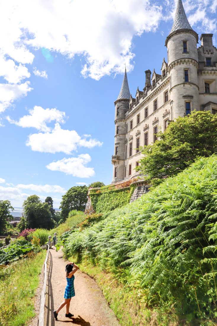 Dunrobin Castle Gemma Holding Hat North Coast 500 Scotland_