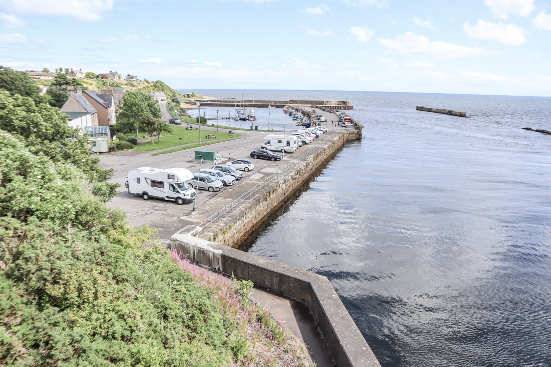 Campers parked at Helmsdale car park by the sea on the North Coast 500 Scotland_