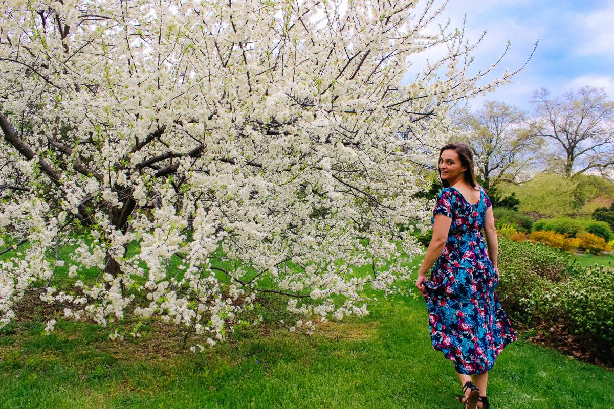 Girl in dress, walking in garden