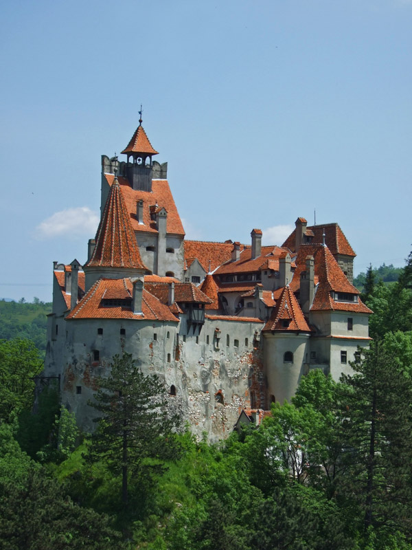 Bran Castle surrounded by green trees