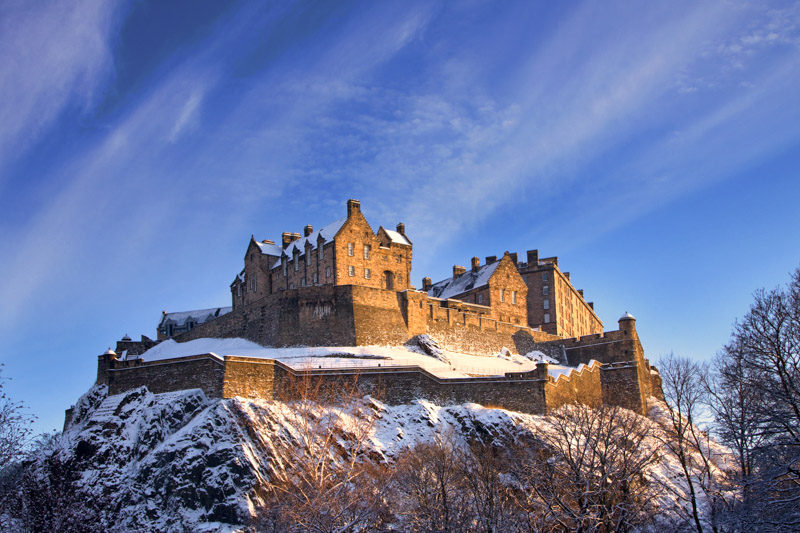 Edinburgh Castle with snow and blue skies _