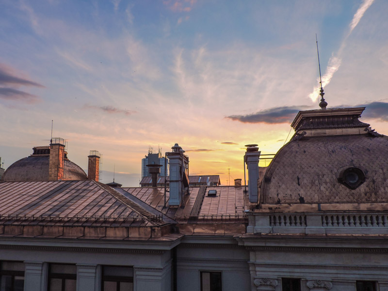 Sunset over buildings in Bucharest Old Town
