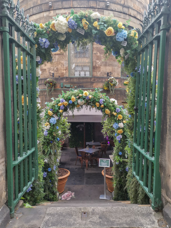 Rose Street Garden entrance with flowers_