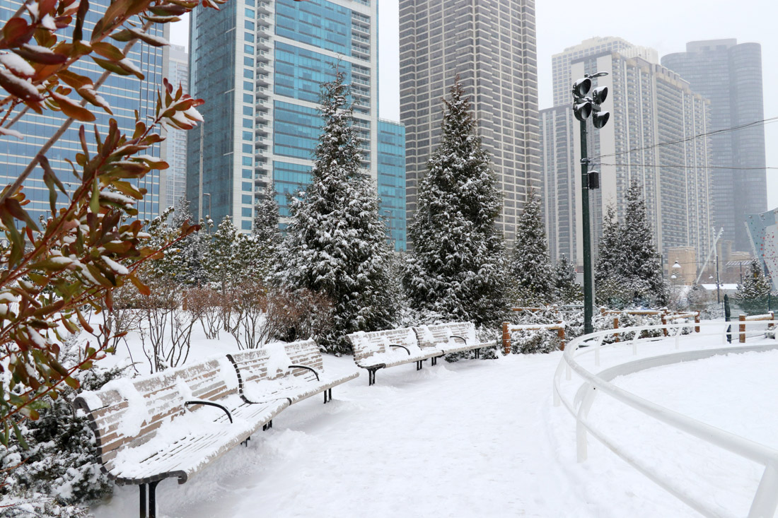 Chicago in December in Winter skyscrapers and bench