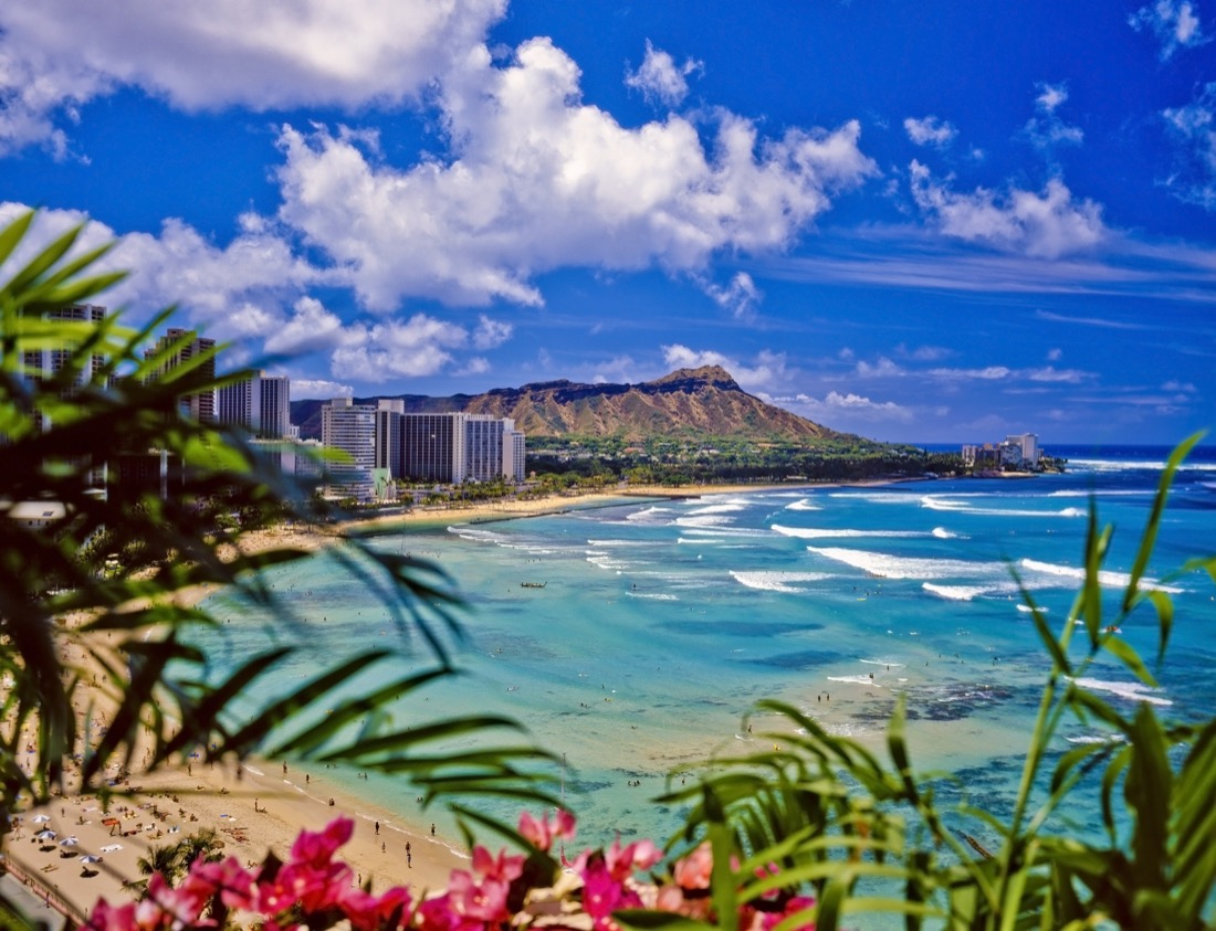 Intense blue ocean and skies at Waikiki beach and diamond head in Honolulu.