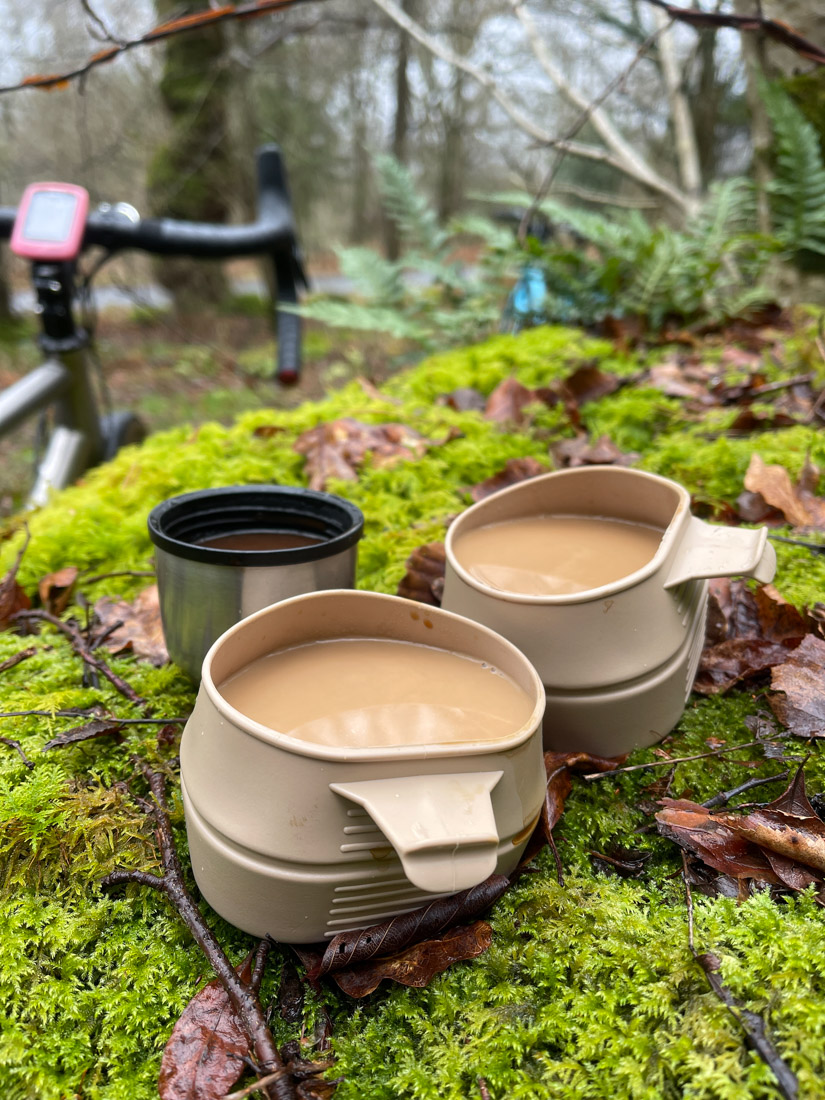 Coffee in cups from flask in forest near Dumfries
