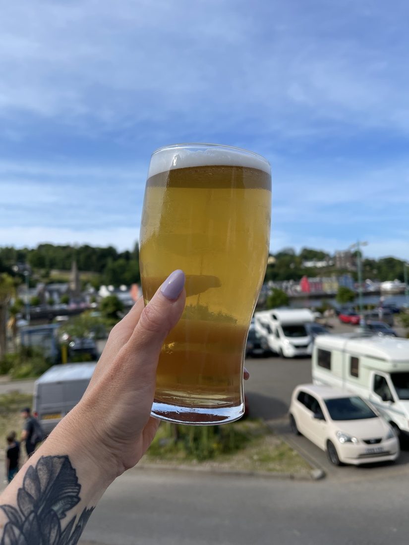 Beer cheersing over Tobermory on Mull in Scotland