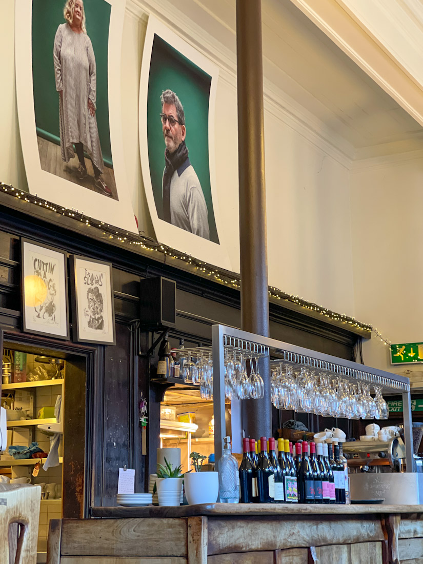 Art work behind bar at Cafe Gandolfi in Glasgow 