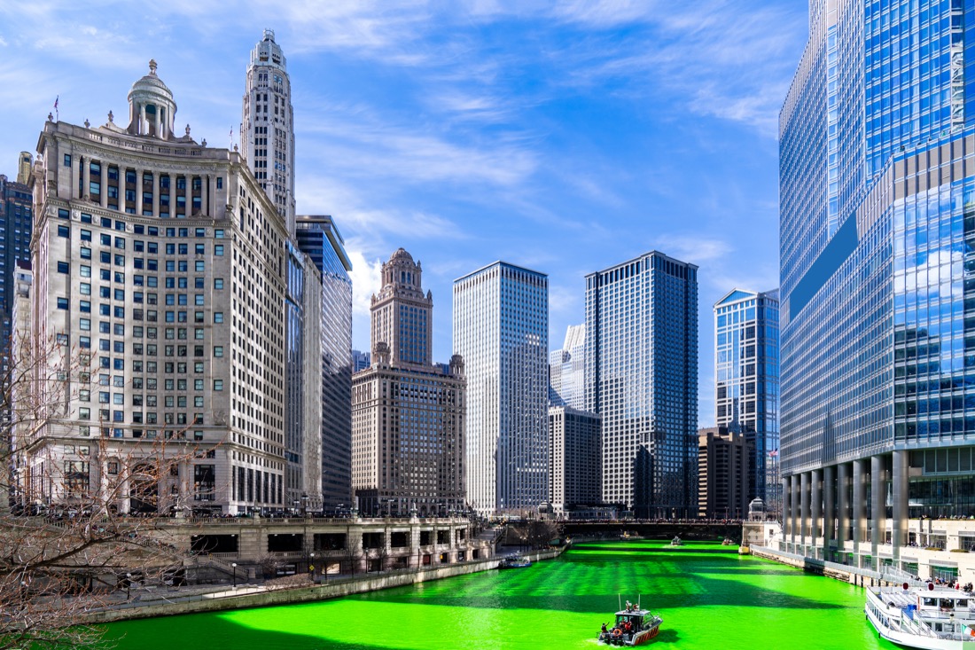 Chicago Skylines building along green river of Chicago River on St. Patrick's day festival in Chicago Downtown