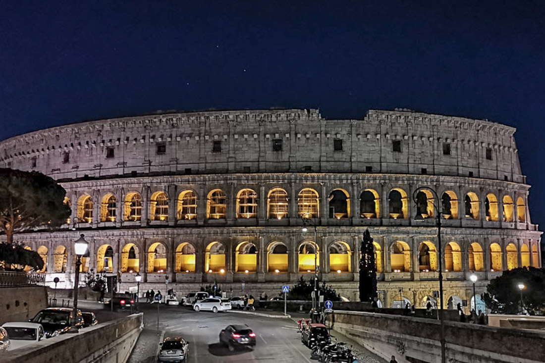 Colosseum at nigh with dark blue sky Rome