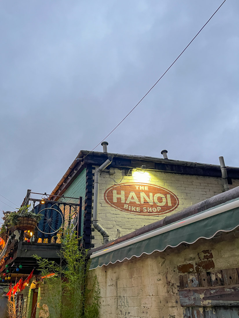 Hanoi Bike Shop sign on building forVietnamese food in Glasgow sign
