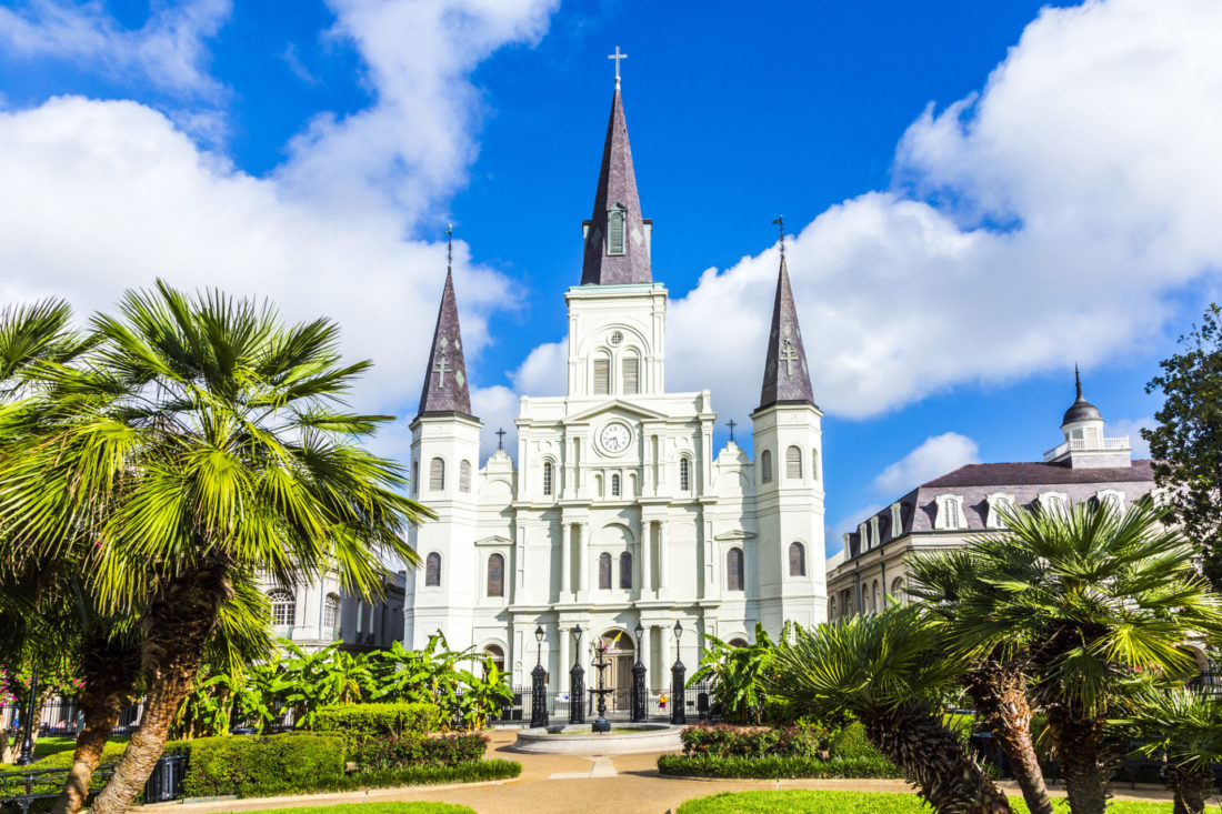White building Saint Louis Cathedral in New Orleans with blue sky
