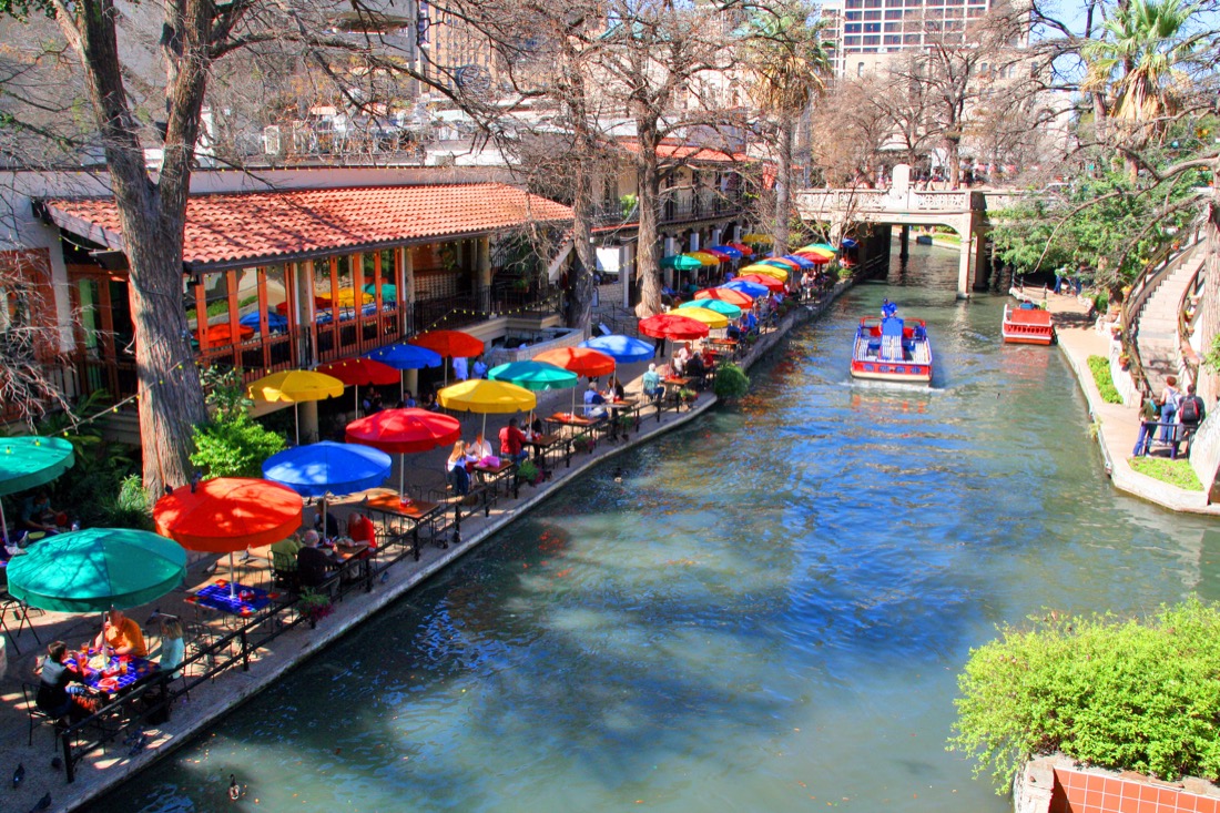 Colorful umbrellas of restaurants along the San Antonio Riverwalk in Texas