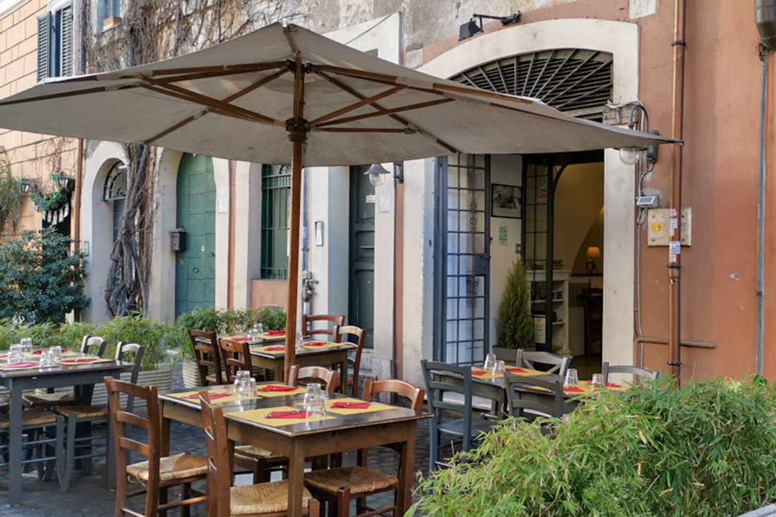 Trastevere restaurant bar with tables outside Rome food