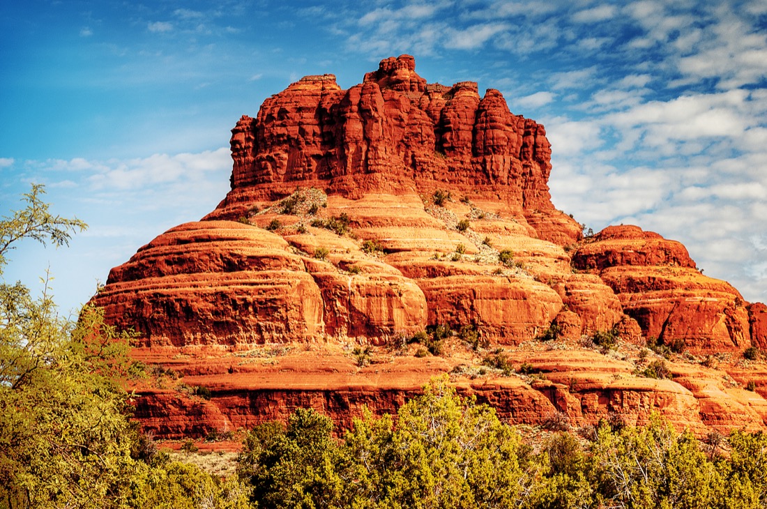 Red toned Bell Rock with blue skies in Sedona Arizona