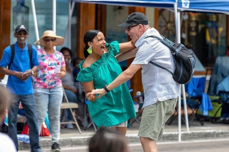 Couple dancing in street at Bermuda Day Carnival