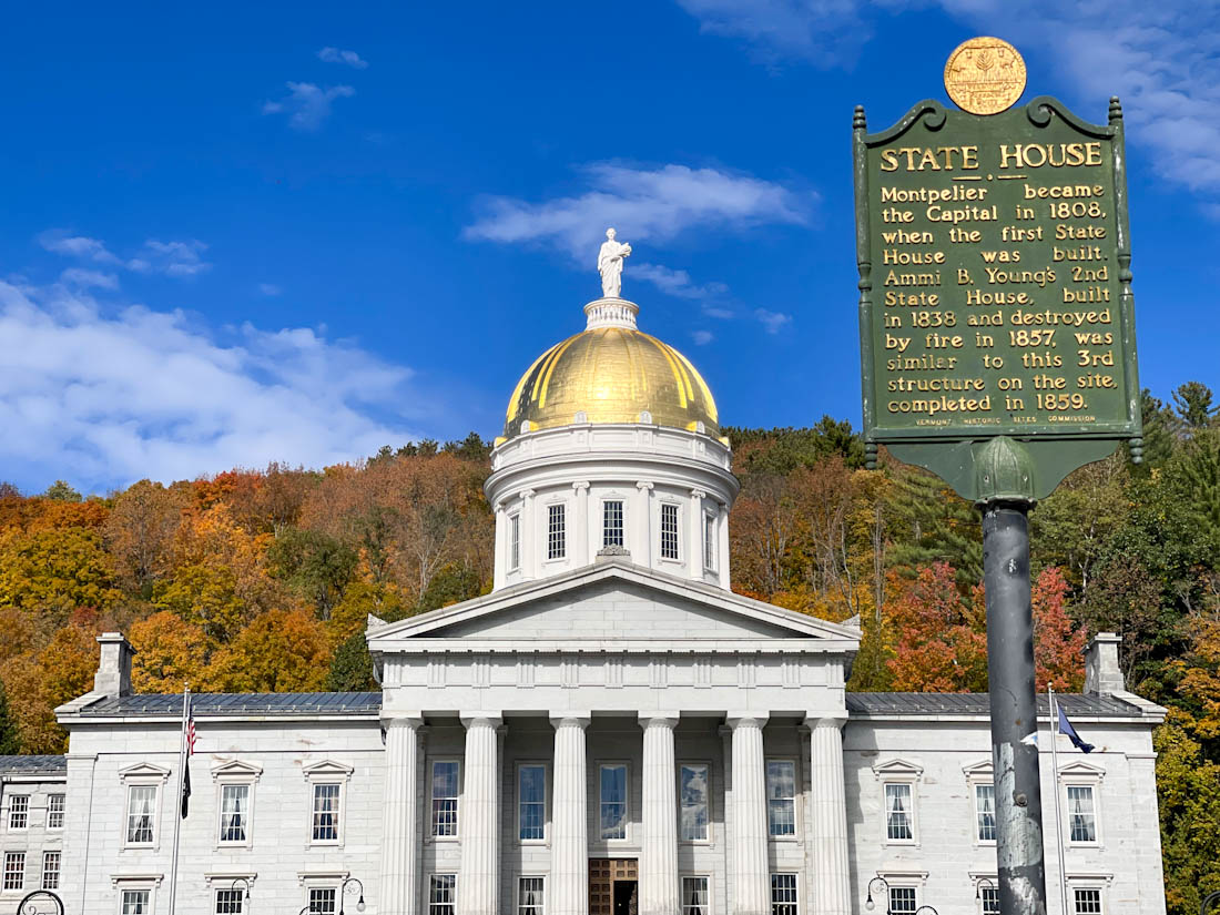 Fall colors behind the Vermont State House sign Montpelier