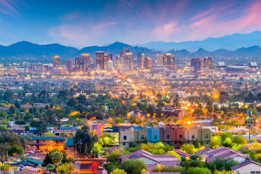 Phoenix Arizon skyline at dusk - trees, buildings and mountains