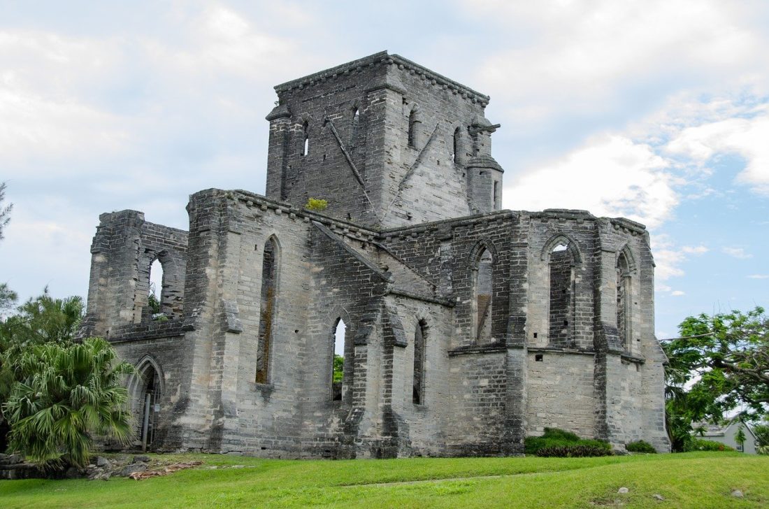 Grey ruins of Unfinished Church Bermuda on green grass