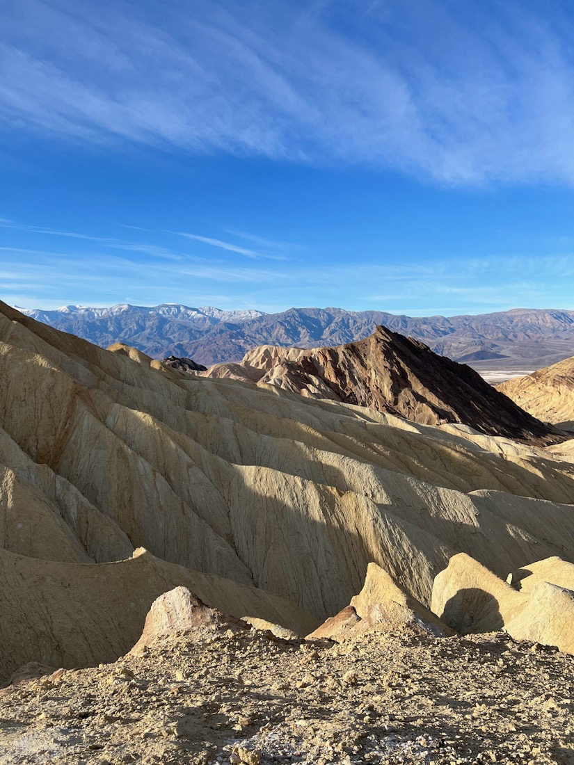 Blue skies over yellow cliffs at Death Valley National Park