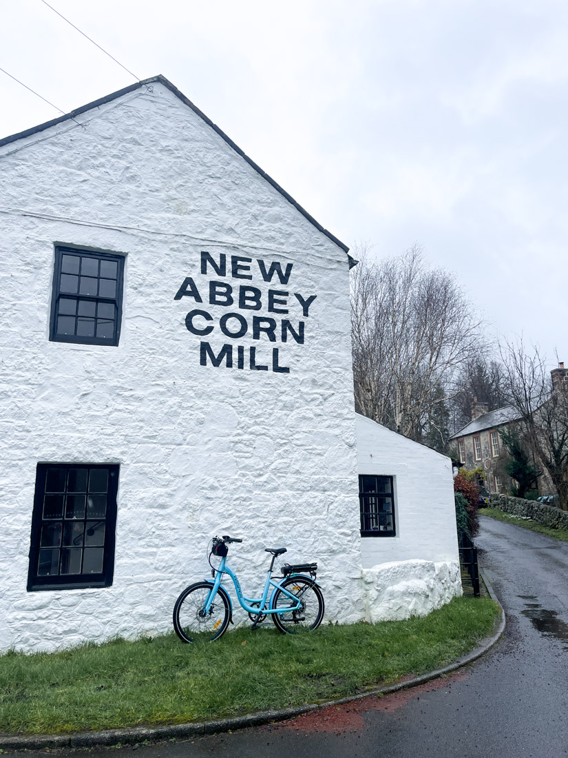 New Abbey Corn Mill white building with bike at New Abbey