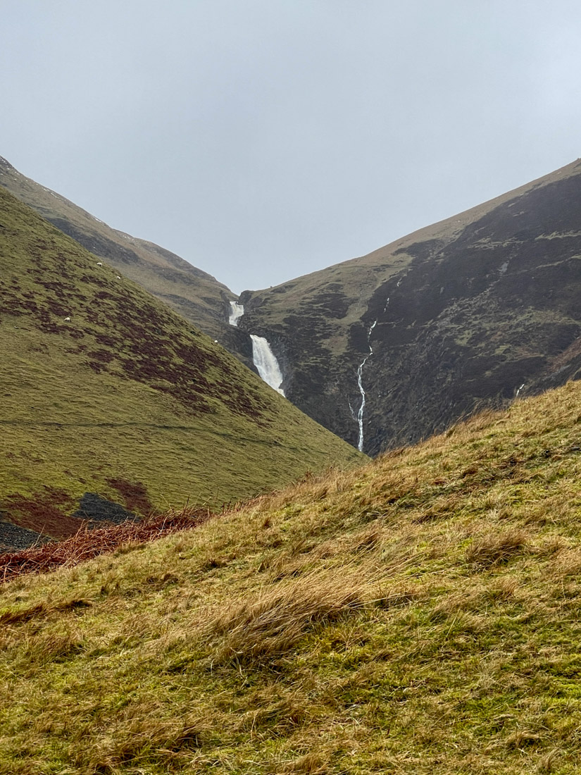 Brown and green tone on a hill with waterfall at Grey Mare's Tail Nature Reserve
