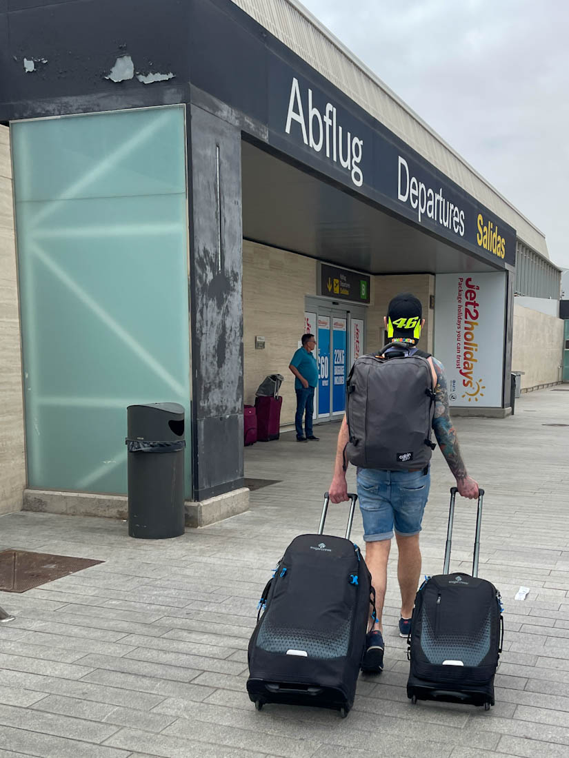 Man pulling Eagle Creek luggage at Tenerife South airport