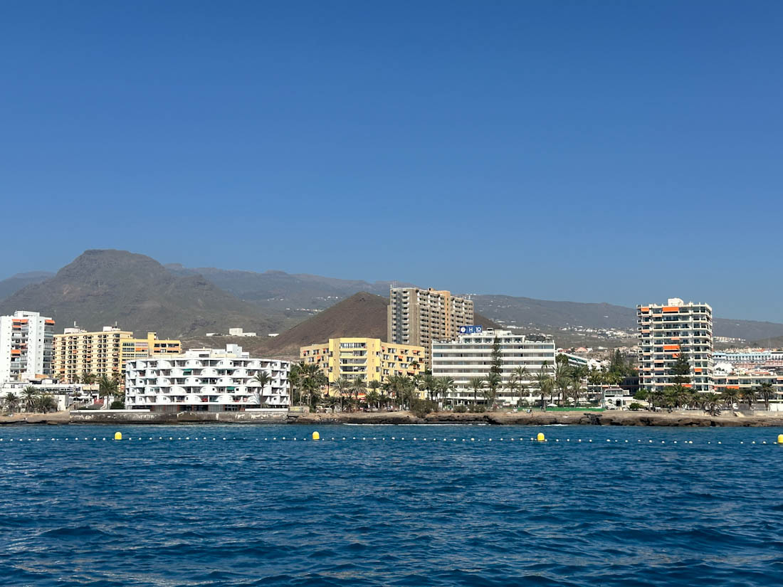 Hotels line water at Los Cristianos Beach in Tenerife