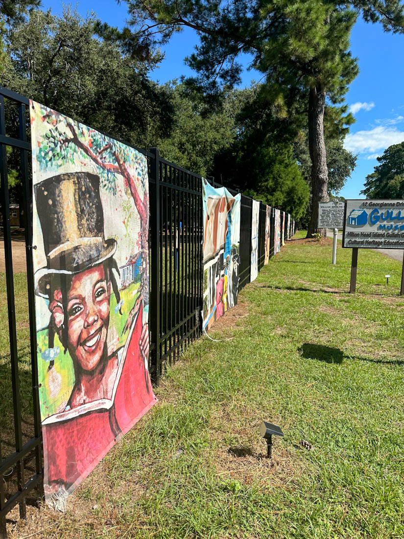 Paintings line the gate of Gullah Museum Hilton Head Island 