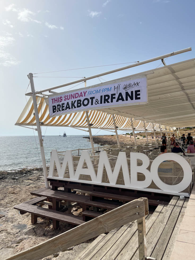 Outdoor seating area over beach at Cafe Mambo bar Ibiza