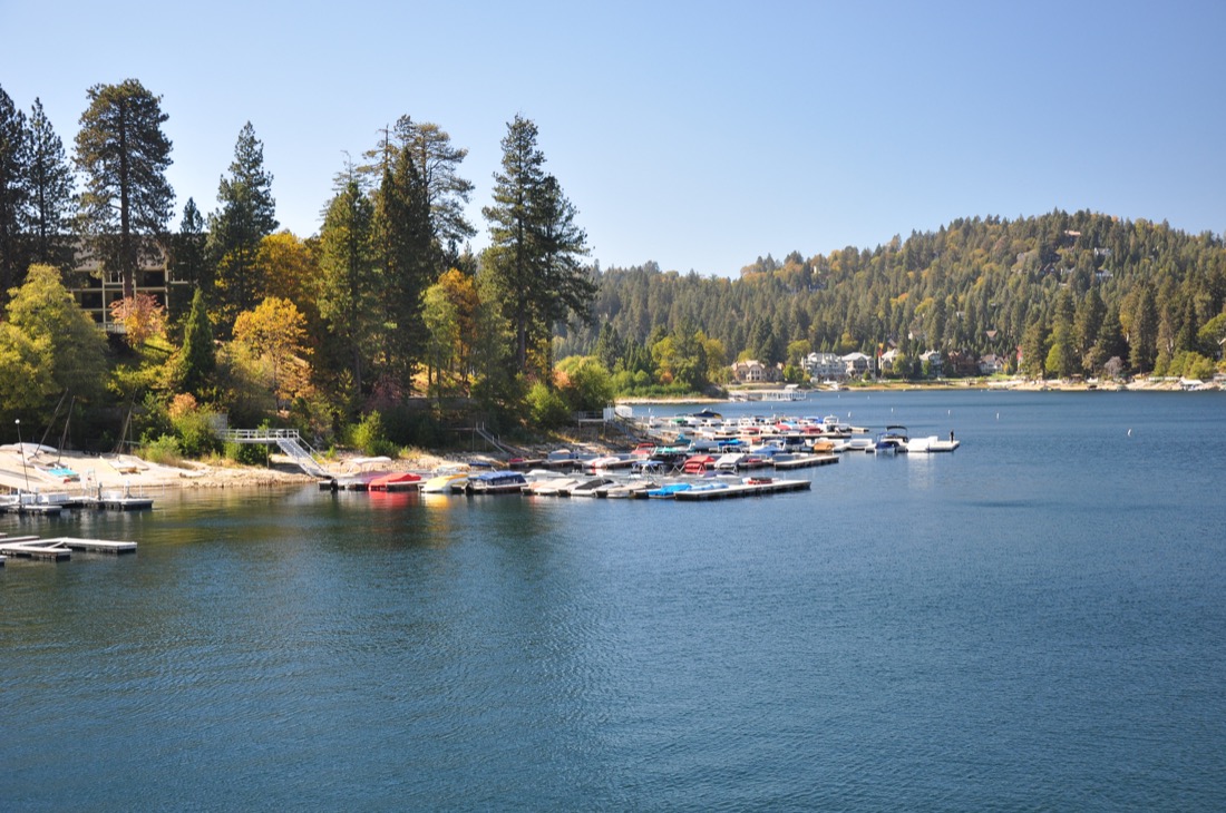 Blue water with collection of fall color trees at Lake Arrowhead 
