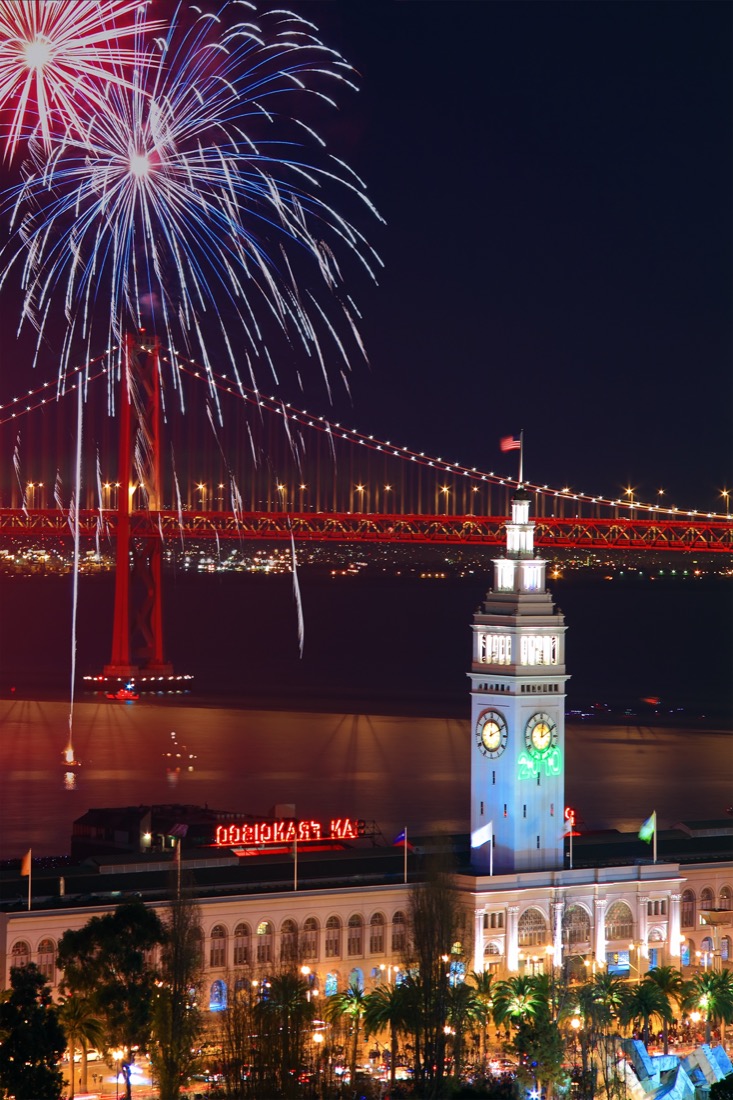 View of fireworks above Ferry Building Bay Bridge in San Francisco 