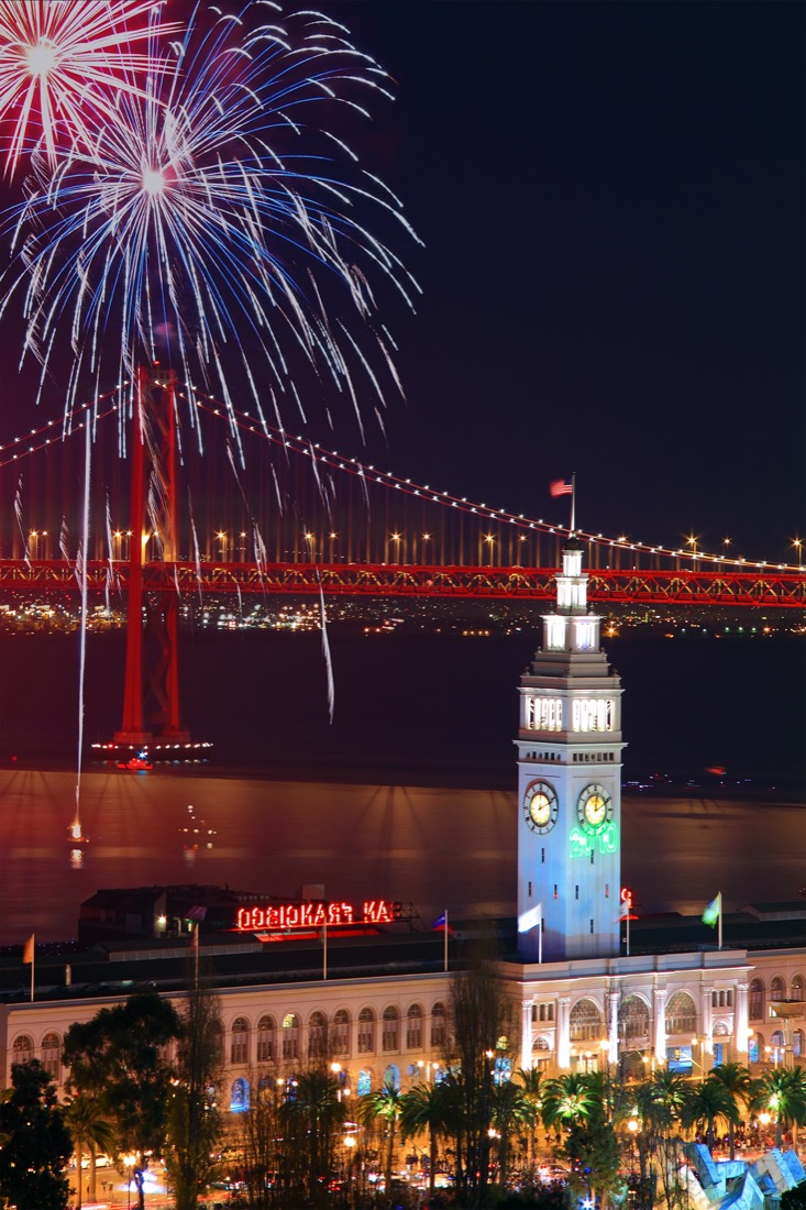 View of fireworks above Ferry Building Bay Bridge in San Francisco